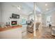 Cozy living room with fireplace, wood floors, ceiling fans, and open floor plan at 2177 Gulf Dr, Mount Pleasant, SC 29464