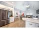 Open concept kitchen, living and dining areas with stainless steel appliances and vaulted ceiling at 2177 Gulf Dr, Mount Pleasant, SC 29464