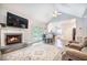 Comfortable living room with a fireplace and adjacent dining and kitchen areas at 2177 Gulf Dr, Mount Pleasant, SC 29464
