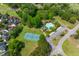 An aerial view of community amenities including pool, tennis court, and golf course amidst lush green landscaping at 2221 Black Oak Ct, Mount Pleasant, SC 29466
