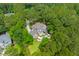 Breathtaking aerial view of an estate nestled amidst a dense forest, complete with a sparkling pool at 2221 Black Oak Ct, Mount Pleasant, SC 29466