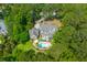 Sprawling home with a backyard pool and screened-in porch, surrounded by a canopy of mature trees at 2221 Black Oak Ct, Mount Pleasant, SC 29466