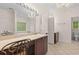 Spacious bathroom with a makeup vanity, a large mirror, a soaking tub, and stylish lighting fixtures at 2221 Black Oak Ct, Mount Pleasant, SC 29466