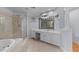 Bright bathroom features a soaking tub, walk-in shower and vanity with great storage space at 2221 Black Oak Ct, Mount Pleasant, SC 29466