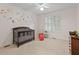 A charming bedroom features carpet, a crib, neutral walls, and decorative moon and space-themed decals at 2221 Black Oak Ct, Mount Pleasant, SC 29466