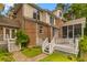 Stunning two-story brick and siding home featuring a spacious deck and lush landscaping at 2221 Black Oak Ct, Mount Pleasant, SC 29466