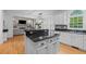 Open-concept kitchen featuring island, granite countertops, stainless sink and view to adjacent living space at 2221 Black Oak Ct, Mount Pleasant, SC 29466