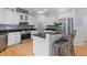 Well-lit kitchen features stainless appliances, breakfast bar, granite counters and stylish backsplash at 2221 Black Oak Ct, Mount Pleasant, SC 29466