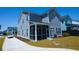 Beautiful gray two-story home with a screened in porch and manicured lawn at 232 Ashworth Dr, Summerville, SC 29486