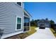 View of the home's garage and driveway on a bright and sunny day at 232 Ashworth Dr, Summerville, SC 29486