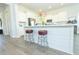 Kitchen island with stools and white cabinets featuring stainless steel appliances at 232 Ashworth Dr, Summerville, SC 29486