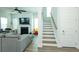 Bright living room with hardwood floors, fireplace, and staircase at 232 Ashworth Dr, Summerville, SC 29486