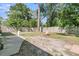 Spacious fenced backyard with a fire pit, shade trees, and room to entertain at 242 Amy Dr, Goose Creek, SC 29445