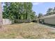 Large fenced backyard with a fire pit and room for outdoor activities at 242 Amy Dr, Goose Creek, SC 29445