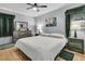 Comfortable bedroom featuring wood floors, dresser, and soft lighting, creating a serene retreat at 242 Amy Dr, Goose Creek, SC 29445