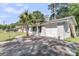 Residential exterior features an attached one-car garage and a well-paved driveway, perfect for easy parking at 242 Amy Dr, Goose Creek, SC 29445