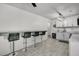 Bright kitchen featuring counter seating, white cabinetry, modern appliances, and tiled flooring for a clean, modern look at 242 Amy Dr, Goose Creek, SC 29445