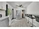 Bright kitchen with tile floors, stainless steel refrigerator, and breakfast bar perfect for casual dining at 242 Amy Dr, Goose Creek, SC 29445