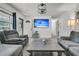 Spacious living room with a large sectional, recliner, and mounted TV, designed for comfort and entertainment at 242 Amy Dr, Goose Creek, SC 29445