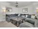 Inviting living area complete with a plush sectional, coffee table, soft lighting, and stylish decor at 242 Amy Dr, Goose Creek, SC 29445