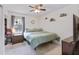 Cozy bedroom with a ceiling fan, a window with curtains, and neutral décor at 264 Columbia Dr, Ladson, SC 29456