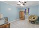 Comfortable bedroom with a ceiling fan, wooden furniture, including a comfy papasan chair by the window at 264 Columbia Dr, Ladson, SC 29456