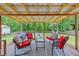 Inviting covered patio with a variety of seating arrangements, perfect for outdoor relaxation and entertaining at 264 Columbia Dr, Ladson, SC 29456