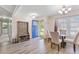 Bright foyer featuring hardwood floors, a hall tree, and a dining area with natural light at 264 Columbia Dr, Ladson, SC 29456