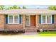 Close up of a home's inviting front porch with blue shutters and brickwork details at 264 Columbia Dr, Ladson, SC 29456