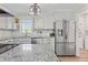 Modern kitchen with granite countertops, stainless steel appliances, and ample cabinet space at 264 Columbia Dr, Ladson, SC 29456