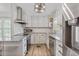 Bright kitchen featuring stainless steel appliances, granite countertops, and white cabinets at 264 Columbia Dr, Ladson, SC 29456