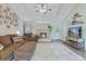 Inviting living room featuring a stone fireplace, vaulted ceiling, and comfortable brown sofa seating at 264 Columbia Dr, Ladson, SC 29456