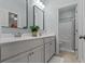 A clean bathroom showcasing double sinks, a light color palette, and a shower/bath room at 2792 River Vista Way, Mount Pleasant, SC 29466