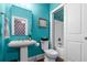 Quaint bathroom features a pedestal sink, decorative mirror and tub/shower combo with an overhead light at 2792 River Vista Way, Mount Pleasant, SC 29466