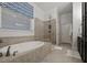 Bathroom with bathtub and tiled shower at 2792 River Vista Way, Mount Pleasant, SC 29466