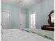 Bright bedroom featuring antique furniture, soothing light-blue walls, and multiple entry doors at 2792 River Vista Way, Mount Pleasant, SC 29466