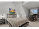 Bright bedroom featuring neutral decor, a cozy bed, and a dedicated desk area at 2792 River Vista Way, Mount Pleasant, SC 29466