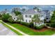 Traditional home featuring a well-manicured front yard, dual porches and mature landscaping at 2792 River Vista Way, Mount Pleasant, SC 29466