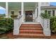 Inviting front entrance with brick steps, decorated doors, and lush greenery at 2792 River Vista Way, Mount Pleasant, SC 29466