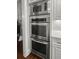 Stainless steel kitchen appliances include a microwave, oven, and warming drawer in a bright kitchen at 2792 River Vista Way, Mount Pleasant, SC 29466