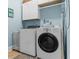 Well-organized laundry room with modern appliances and storage cabinets, offering efficiency and functionality at 2792 River Vista Way, Mount Pleasant, SC 29466