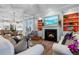 Open concept living room with fireplace, leading to a well-equipped kitchen and dining area at 2792 River Vista Way, Mount Pleasant, SC 29466