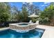 Captivating pool area featuring an in-ground pool, hot tub and lounge chairs at 2792 River Vista Way, Mount Pleasant, SC 29466