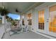Inviting covered porch with rocking chairs, a ceiling fan, and views of the neighborhood at 2792 River Vista Way, Mount Pleasant, SC 29466