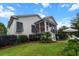 Charming home with a lovely screened porch, neat landscaping and a partially shaded outdoor seating area at 2792 River Vista Way, Mount Pleasant, SC 29466