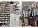 Bright walk-in closet with custom shelving and racks for clothing and shoe storage, providing an organized wardrobe solution at 2792 River Vista Way, Mount Pleasant, SC 29466