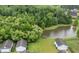 Picturesque aerial view showcasing a pond surrounded by lush greenery and well-maintained residences at 2881 Rutherford Way, Charleston, SC 29414