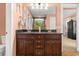 Charming bathroom with a dual sink vanity, granite countertop, and decorative palm leaf at 2881 Rutherford Way, Charleston, SC 29414