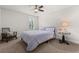 Neutral bedroom featuring carpet, ceiling fan, and a bed with a patterned purple coverlet at 2881 Rutherford Way, Charleston, SC 29414