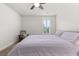 Neutral bedroom featuring carpet, ceiling fan, and a bed with a patterned purple coverlet at 2881 Rutherford Way, Charleston, SC 29414